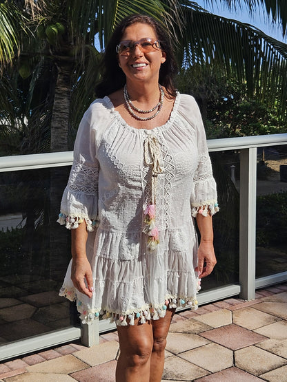 Perfect white summer dress with rainbow pom poms